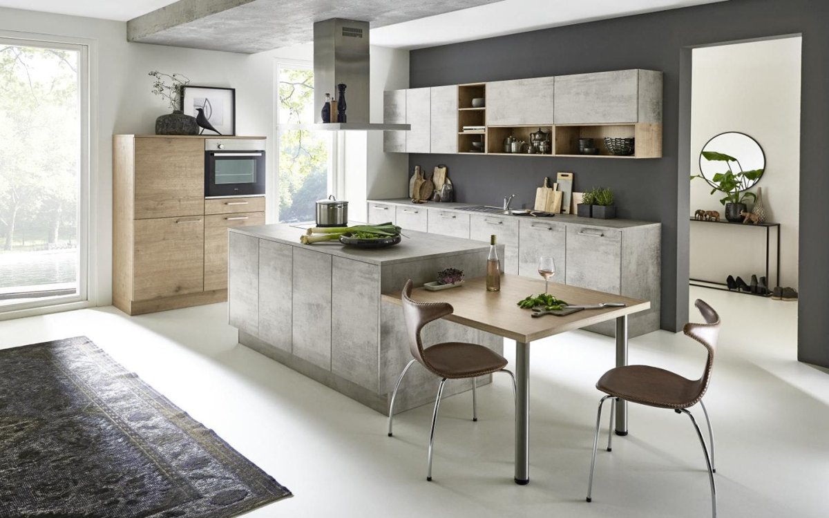 An eye - catching kitchen in light wood and concrete
