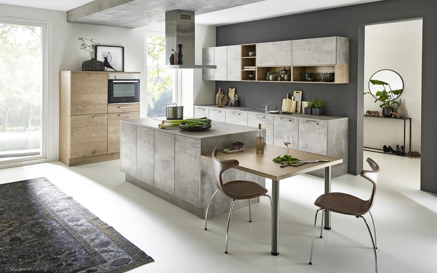 An eye-catching kitchen in light wood and concrete