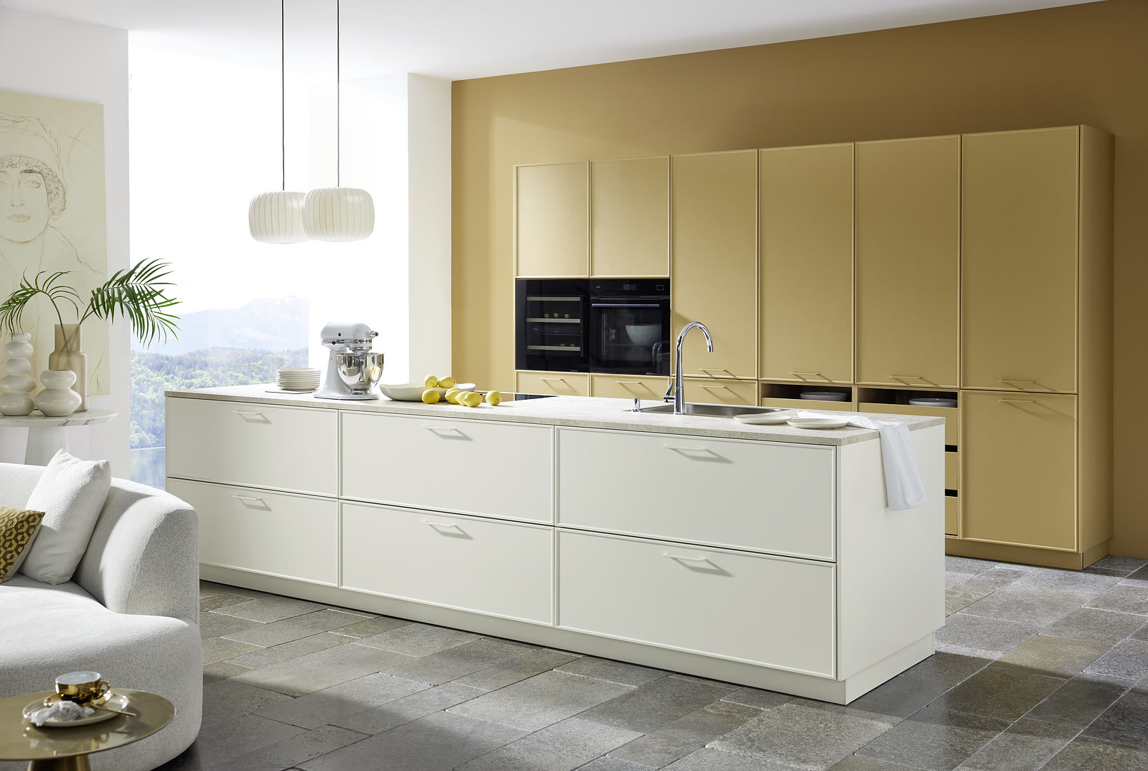 Living space with Evora Lack fronts in caramel soft-matt and magnolia soft-matt.